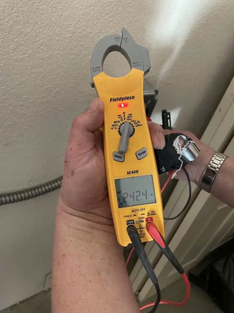 Voltage testing with clamp meter during Generator Installation in Palmview